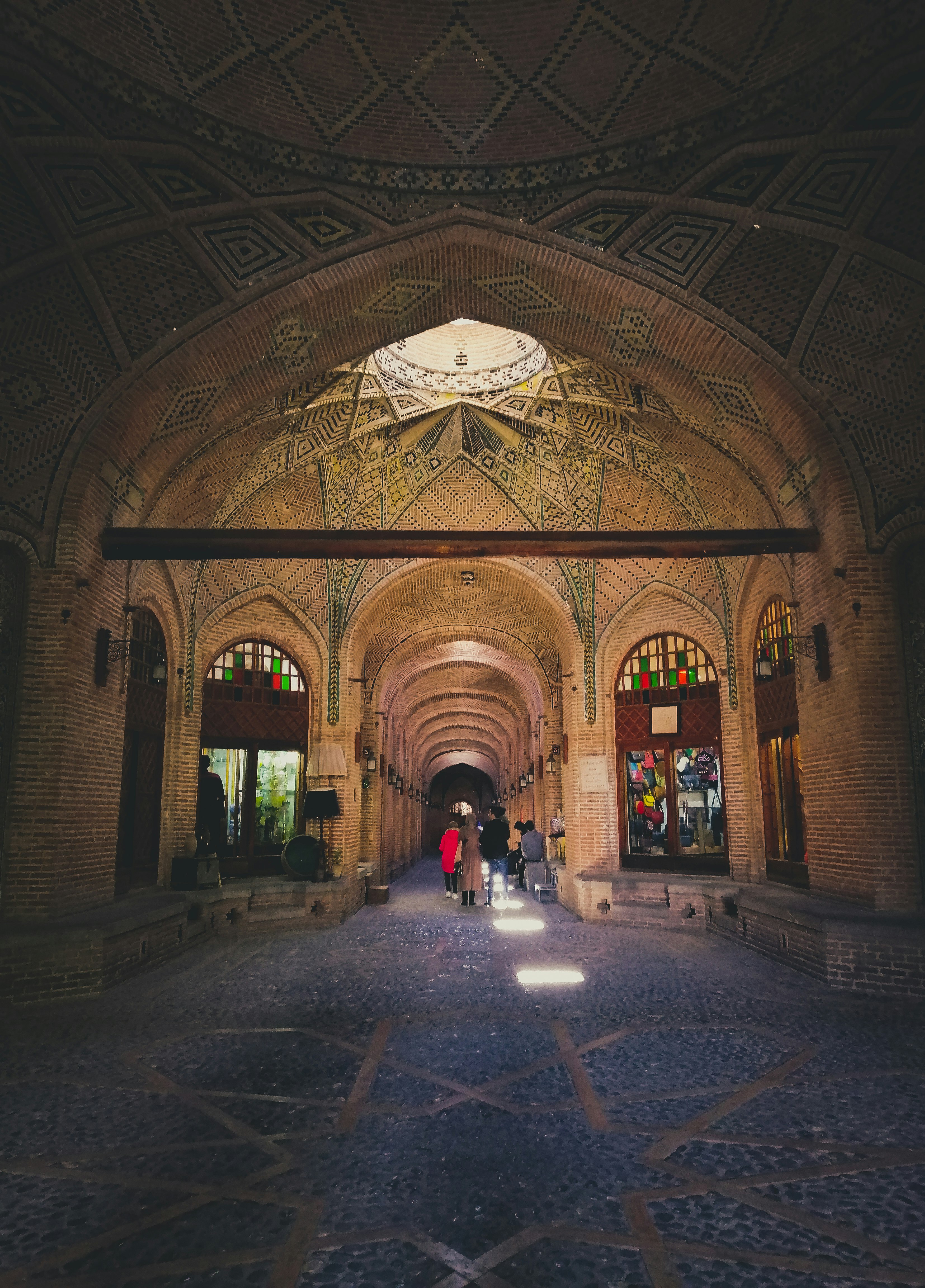 people standing inside historic building